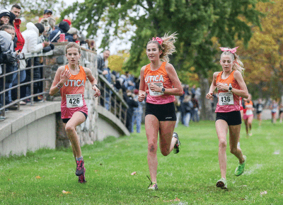  From left, Utica freshman Emma Brown, sophomore Siene Muraszewski and sophomore Brooke McFarland run together during the MAC Championship at Lake St. Clair Metropark Oct. 21.  