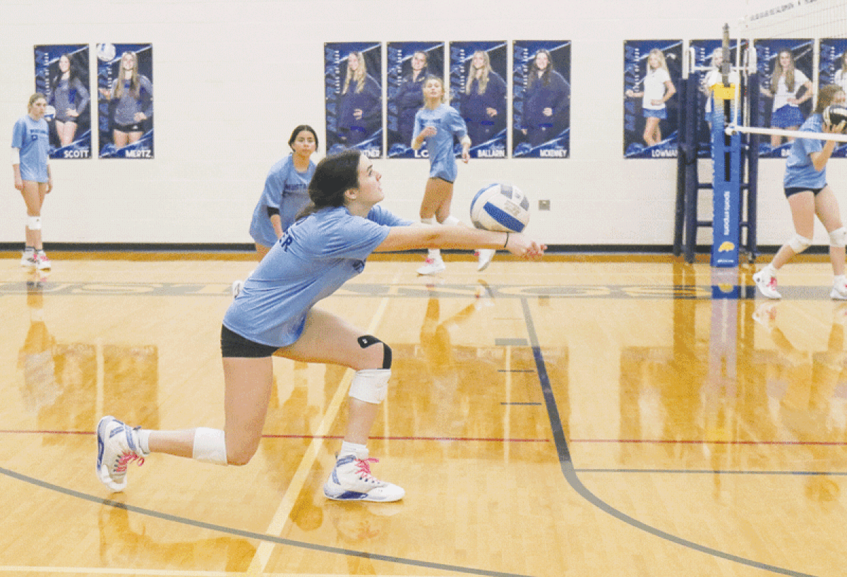  Bloomfield Hills Marian junior outside hitter Izzy Busignani makes a play on the ball during a practice Oct. 19 at Marian High School. 