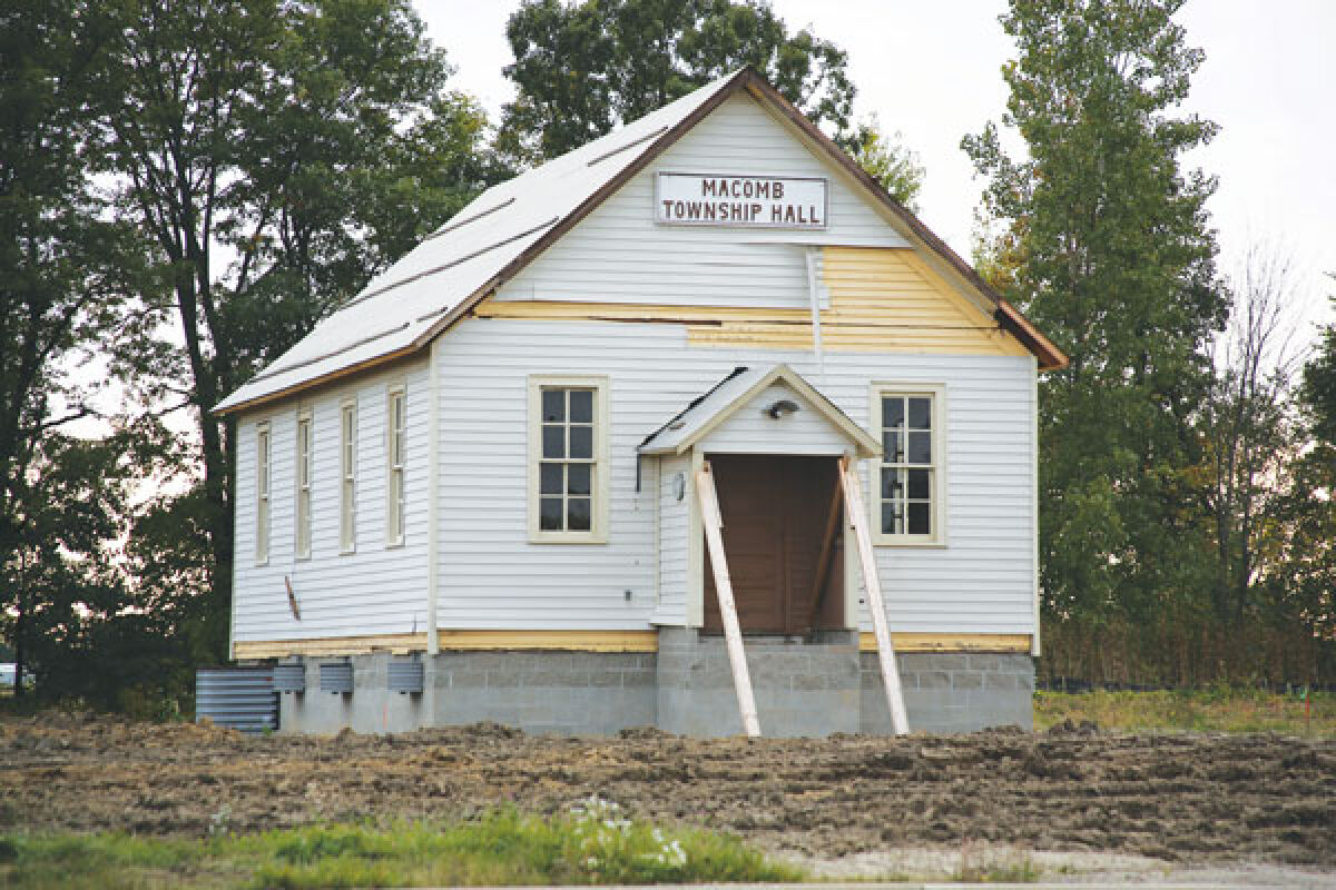  Sitting on its new foundation, the old Macomb Township hall will soon shine with electric light. Township trustees have approved an easement for DTE to install underground electrical infrastructure to bring the 104-year-old building onto the grid. 