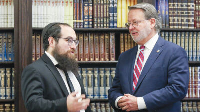  Rabbi Mendel Polter talks with Sen. Gary Peters about the Woodward Avenue Shul, which was the beneficiary of a security grant, Oct. 12. 