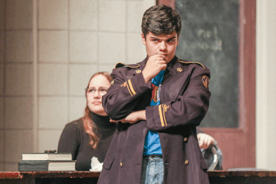  Juror 4, played by Grosse Pointe South High School senior Dylan DeMarco, considers different points in the case during a rehearsal for “12 Angry Jurors.” 