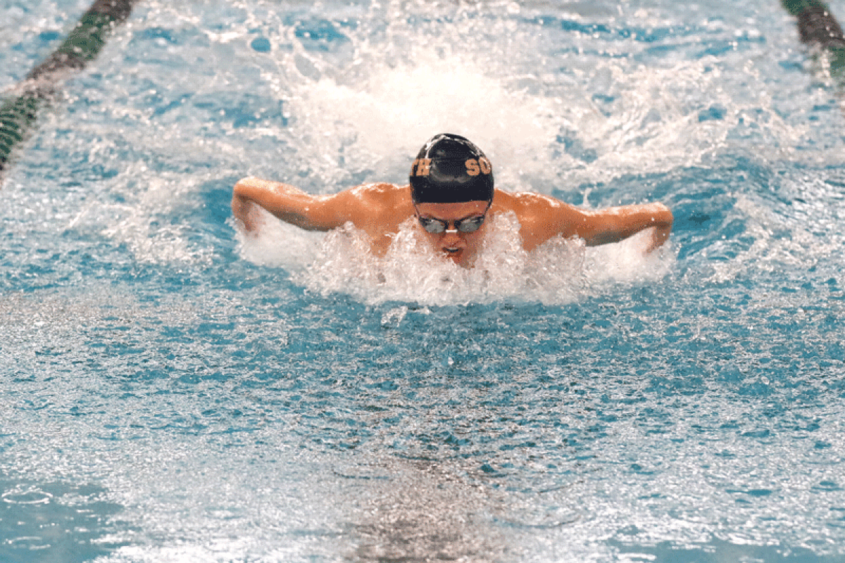  Grosse Pointe South junior Hannah DiDio competes in the 100-yard butterfly during South’s matchup against Macomb Dakota on Oct. 17 at Dakota High School. 