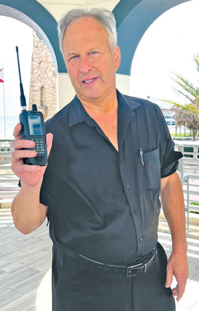 Ira Paul — posing with one of his three scanners, the Uniden SDS 100 — has been listening to local police scanners since 1969. The Southfield police channel has become encrypted, while the Southfield fire channel is still monitorable.  