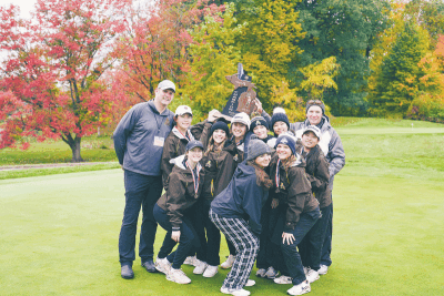  Rochester Adams takes a team photo after repeating as MHSAA  Division 1 State Champions Oct. 21 at Forest Akers West in East Lansing. 