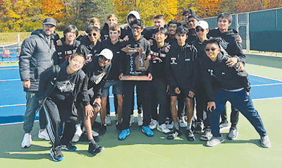  Troy High School celebrates the program’s runner-up finish at the MHSAA Division 1 State Finals at the Greater Midland Tennis Center Oct. 21. 