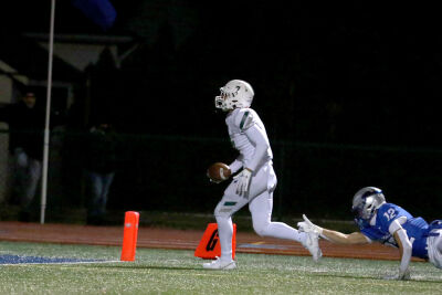  West Bloomfield junior safety Jaiden Allos finishes off his interception with a touchdown score during West Bloomfield’s 24-6 win over Utica Eisenhower on Nov. 3 at Swinehart Stadium. 