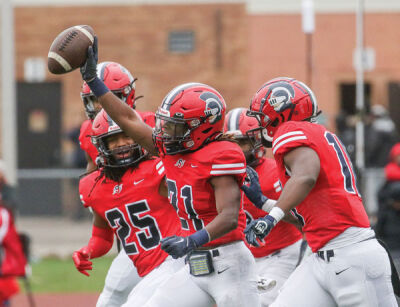  Southfield A&T junior Shamarion Flemming, center, celebrates with his teammates after forcing a strip sack and recovering the fumble. 