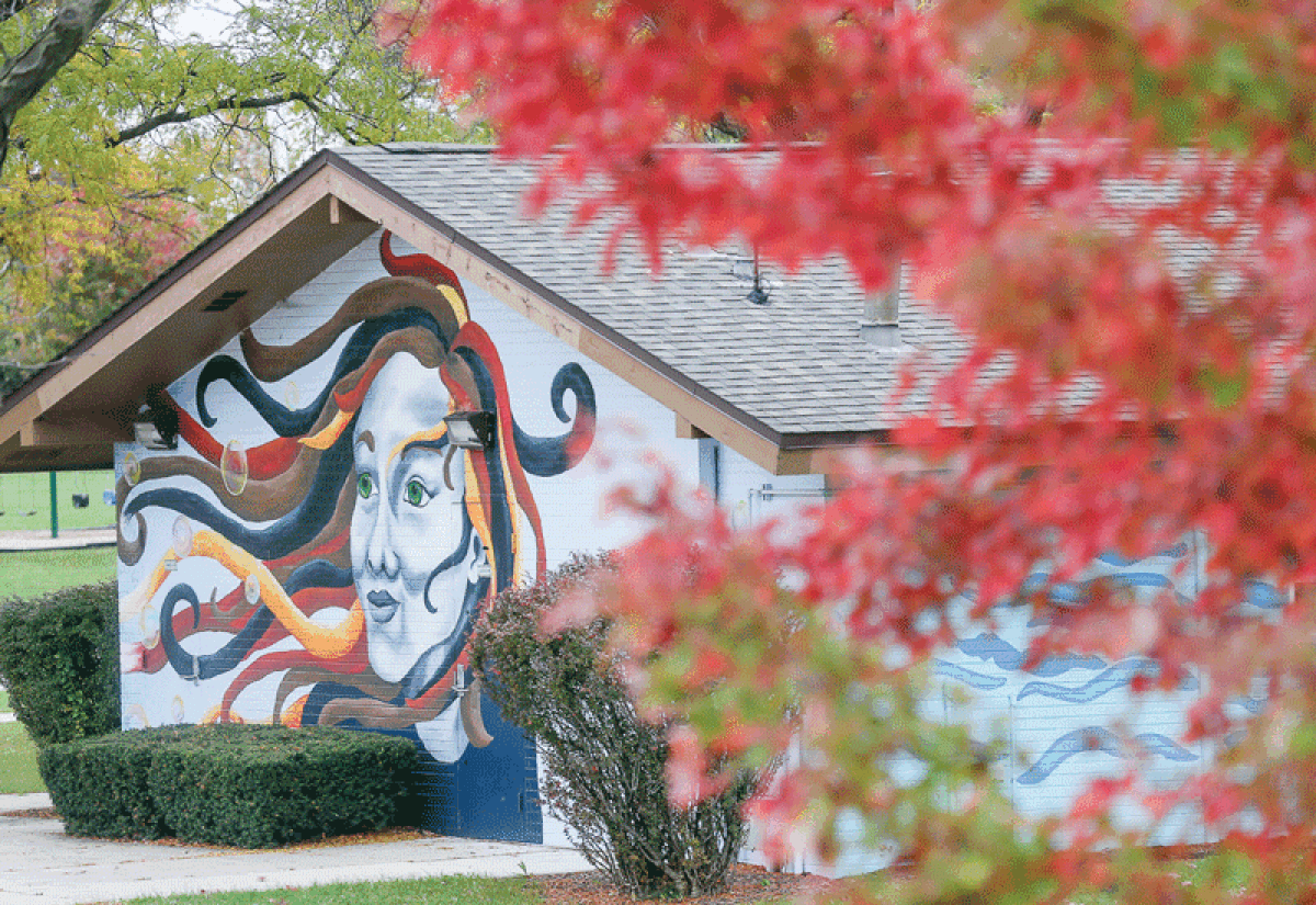  “The Power of Imagination,” by Jennifer Ramirez, spans all four walls of the Jaycees shelter building near the sled hill at Civic Center Park. The same Arts Board that arranged for the mural has now also secured funding for a bandshell that will be set up nearby.  