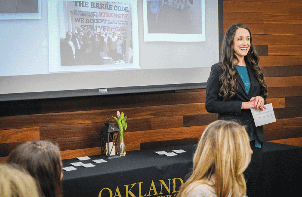  Tiffany LeDonne-Smith, a business program advisor at Oakland University,  speaks at a Women’s Leadership and Mentoring Program event May 2. 
