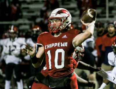  Clinton Township Chippewa Valley senior quarterback Andrew Schuster looks for an open receiver. 