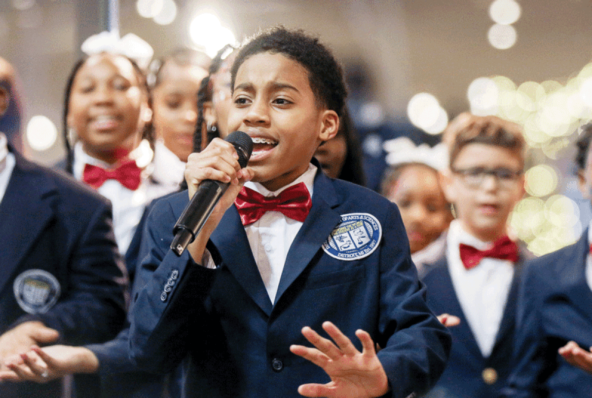  Members of the Detroit Academy of Arts and Sciences Choir perform during the event.  