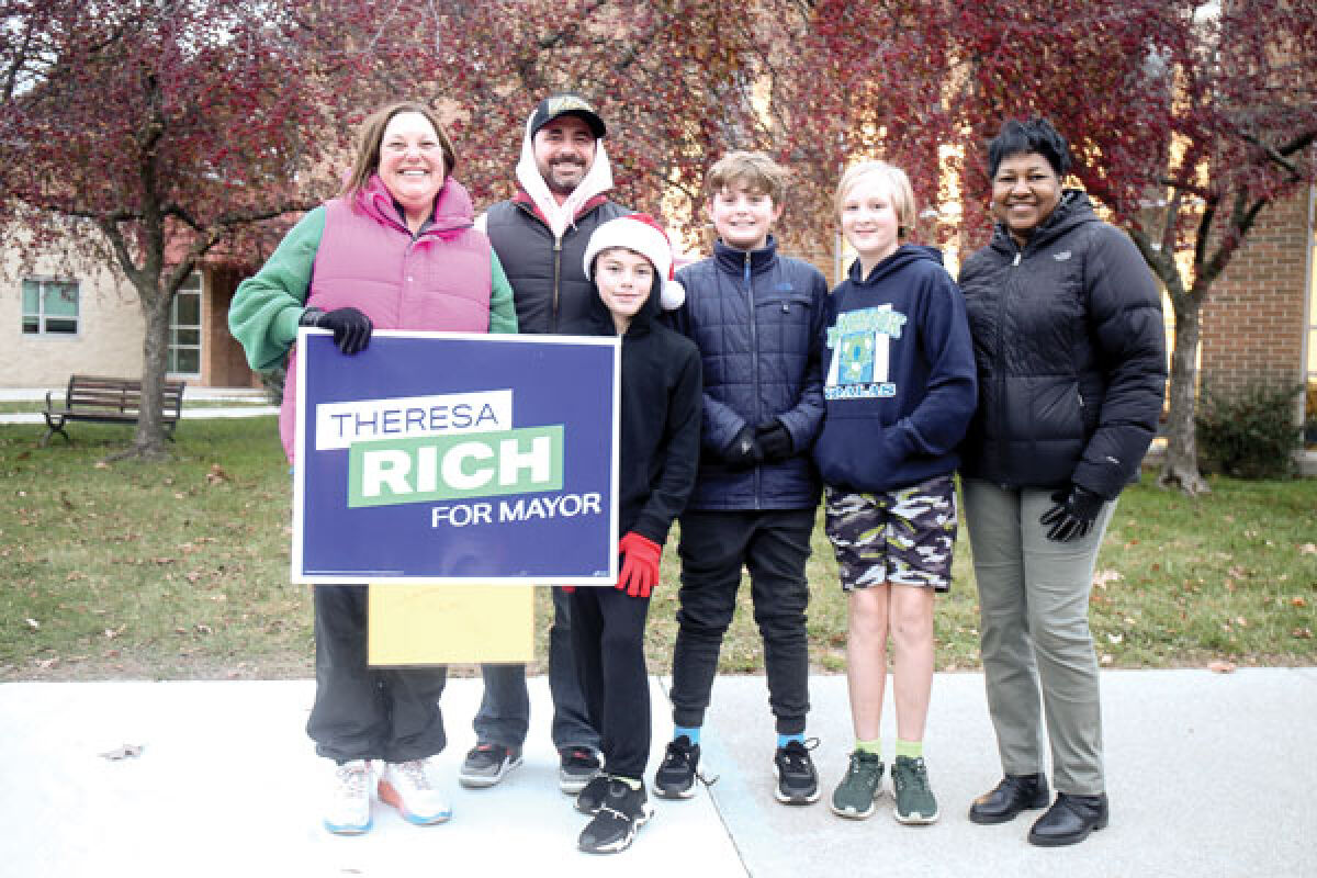  Mayoral candidate Theresa Rich campaigns outside of Kenbrook Elementary School Nov. 7. Rich went on to win her election bid in the general election. 