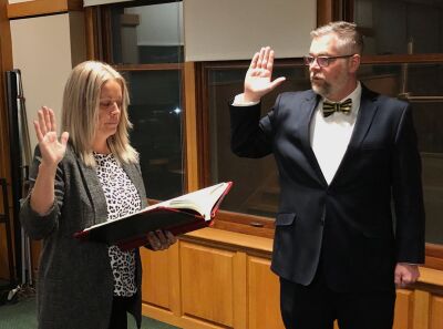  Grosse Pointe Park City Clerk Bridgette Bowdler swears new City Councilman Brent Dreaver into office before a Nov. 13 council meeting. 