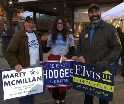  From left, Grosse Pointe Park City Councilman Marty McMillan, Mayor Michele Hodges and council candidate Elvis Torres campaign together at Windmill Pointe Park Nov. 7. 