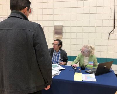  Grosse Pointe Park Precinct 4 Chair John Rizzo and election inspector Mary Quigg-Hillyer assist a voter Nov. 7. 