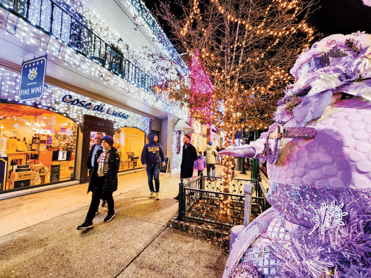   Shoppers stroll through downtown Rochester during last year’s Snowman Stroll.  