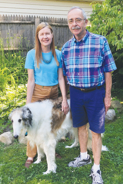  Mary Ellen and John Stempfle and their borzoi, Nikki, stand in the backyard of their former home in Grosse Pointe City. 