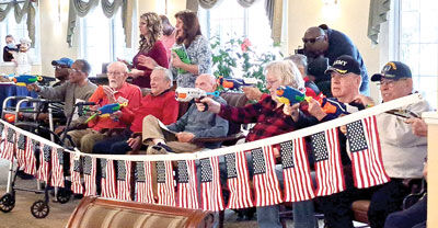  Senior veterans get ready to shoot their Nerf guns during a fun moment of the Veterans Day celebration at Brookdale Senior Living Nov. 10. 