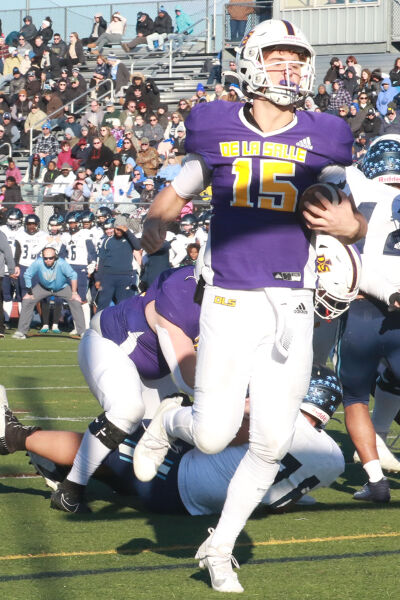  De La Salle junior quarterback Sante Gasperoni runs in for the touchdown during De La Salle’s 45-19 win on Nov. 18 at Troy Athens High School. 