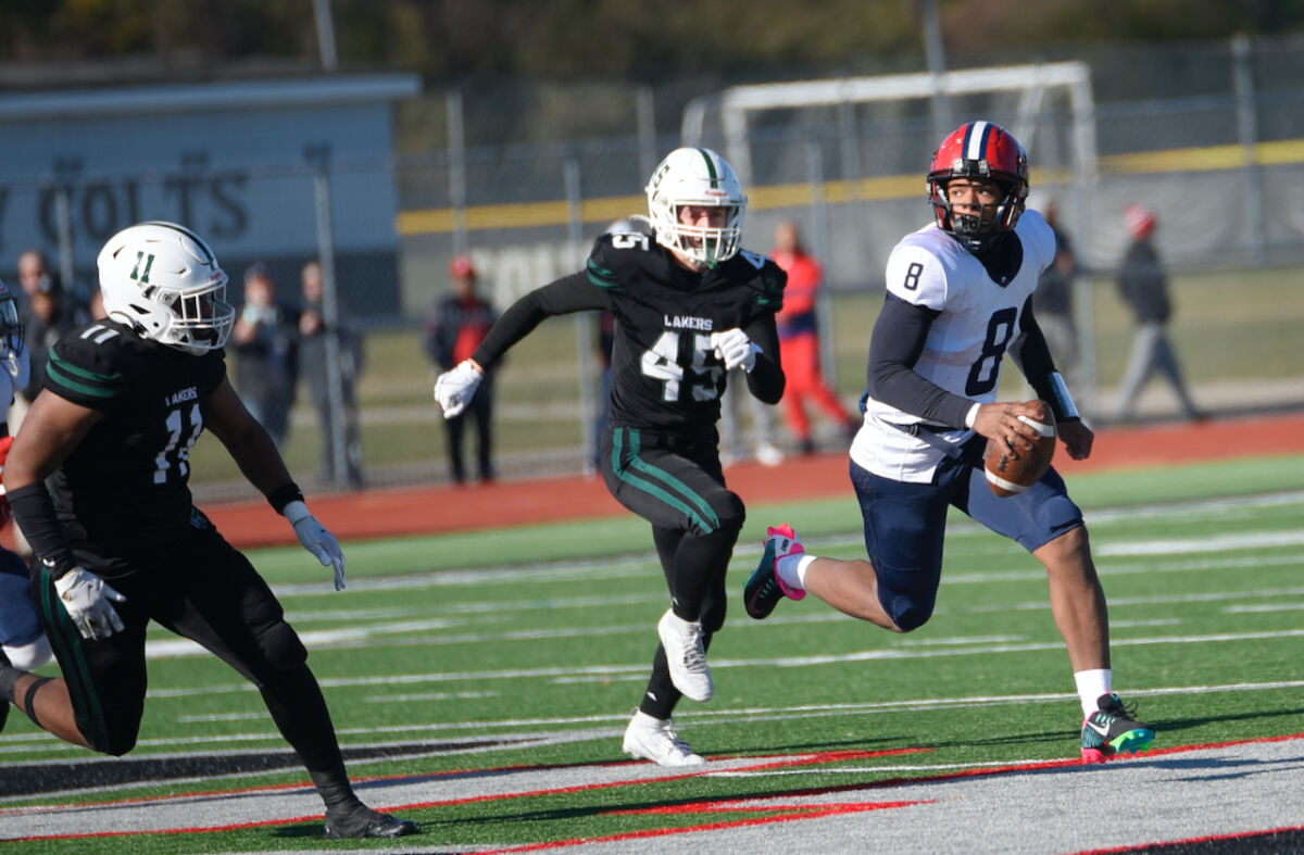  Southfield A&T senior quarterback Isaiah Marshall looks to evade the West Bloomfield defense. 