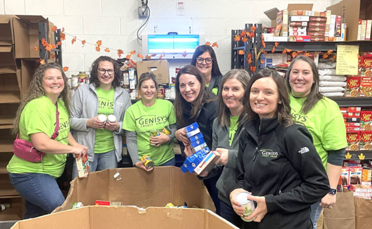  Photo Caption: Genysis Credit Union staff raised more than 2,000 turkeys for families in need this Thanksgiving. 