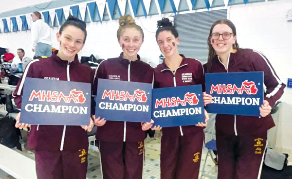  Birmingham Seaholm’s 400-yard freestyle relay consisting of Kelley Hassett, Skyler Jansen, Avery Anderson and Abby Stanley celebrate their state championship win. 