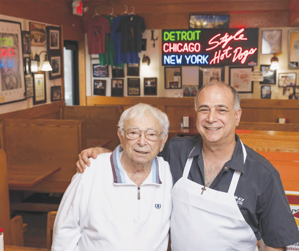  The Rochester Downtown Development Authority honored the memory of former Lipuma’s Coney Island owner Bill Lipuma — pictured here with his son and current business owner Tony Lipuma — by accepting nominations for the first “Bill Lipuma Community Spirit Award.”   