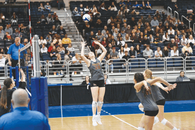  Farmington Hills Mercy junior Campbell Flynn sets the ball for her teammates during the Michigan High School Athletic Association Division 1 State Championship Nov. 18 at Kellogg Arena in Battle Creek. 