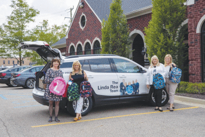  Members of the Linda Rea Team donate to the Blast Off 2 School supply drive. 