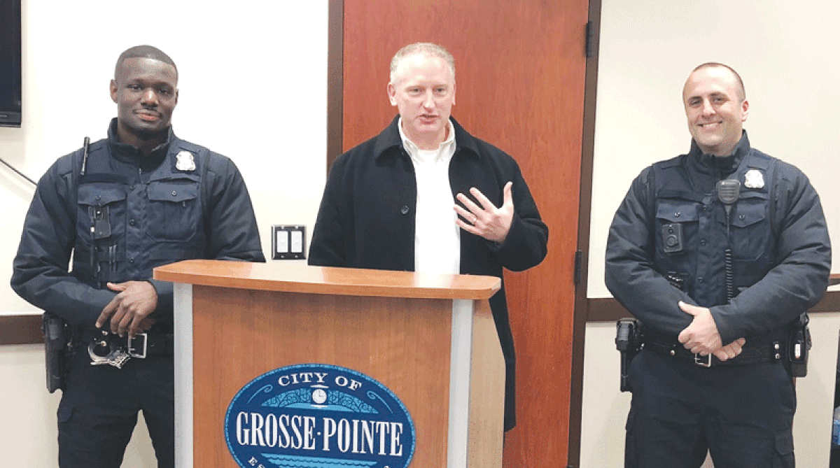  Grosse Pointe City Public Safety Director John Alcorn, center, introduces new City Public Safety Department officers Andre Jones, left, and Mark Dombrowski, right, at a Nov. 20 City Council meeting. 