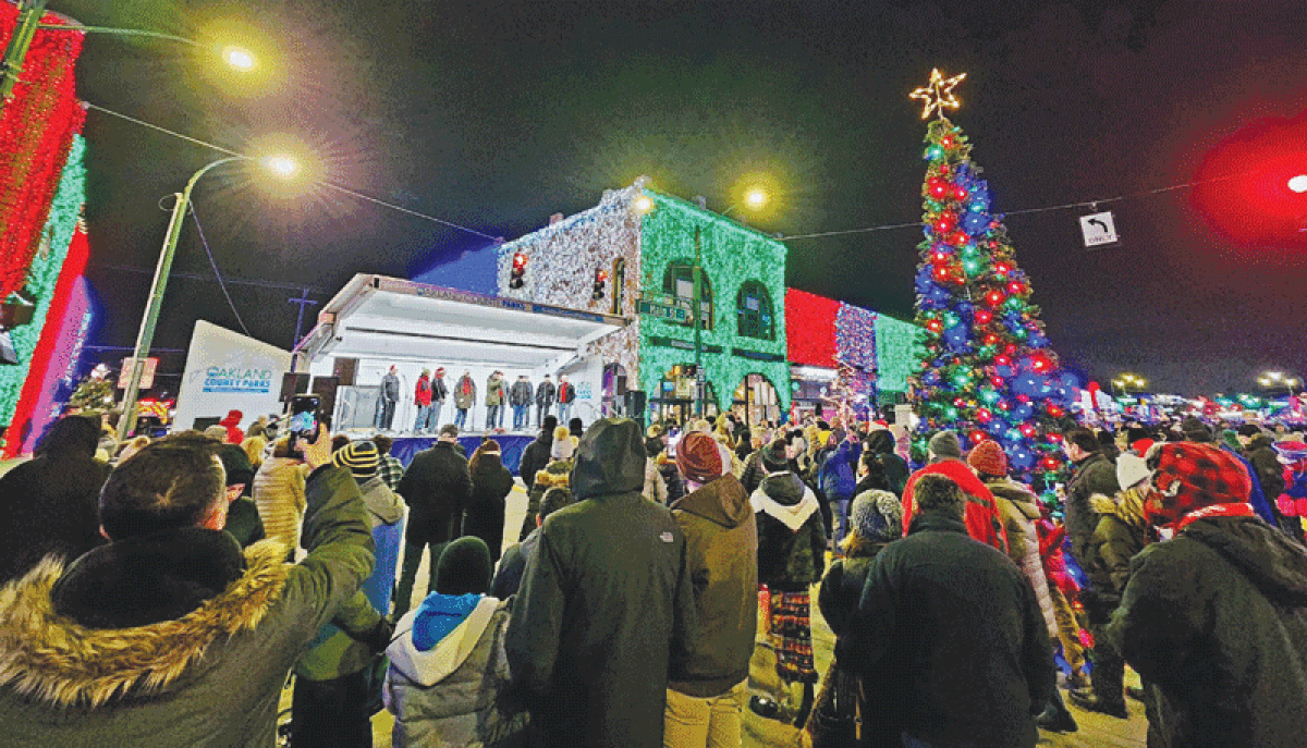  Crowds gather around a 21-foot Christmas tree on Main Street to sing carols during a past Caroling in the City in downtown Rochester. 