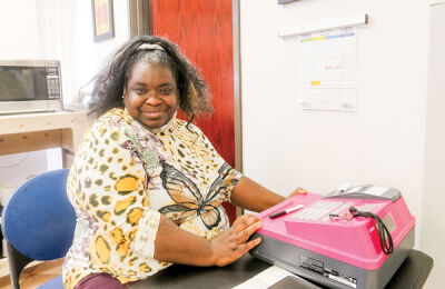  Bridgette works as a cashier at the Snack Shack during the 30th anniversary open house event at the Easterseals Michigan Dreams Unlimited Clubhouse June 21. 