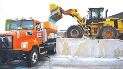  One of the Road Commission’s 140 plow trucks is loaded with salt. 