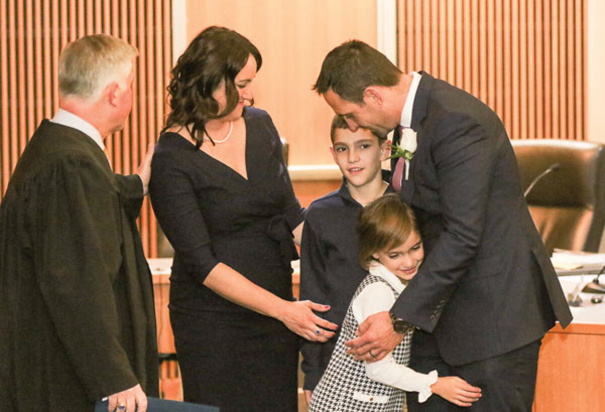  Newly elected and reelected members of the Novi City Council — including Mayor Justin Fischer, right — took the oath of office at the Nov. 20 City Council meeting. 