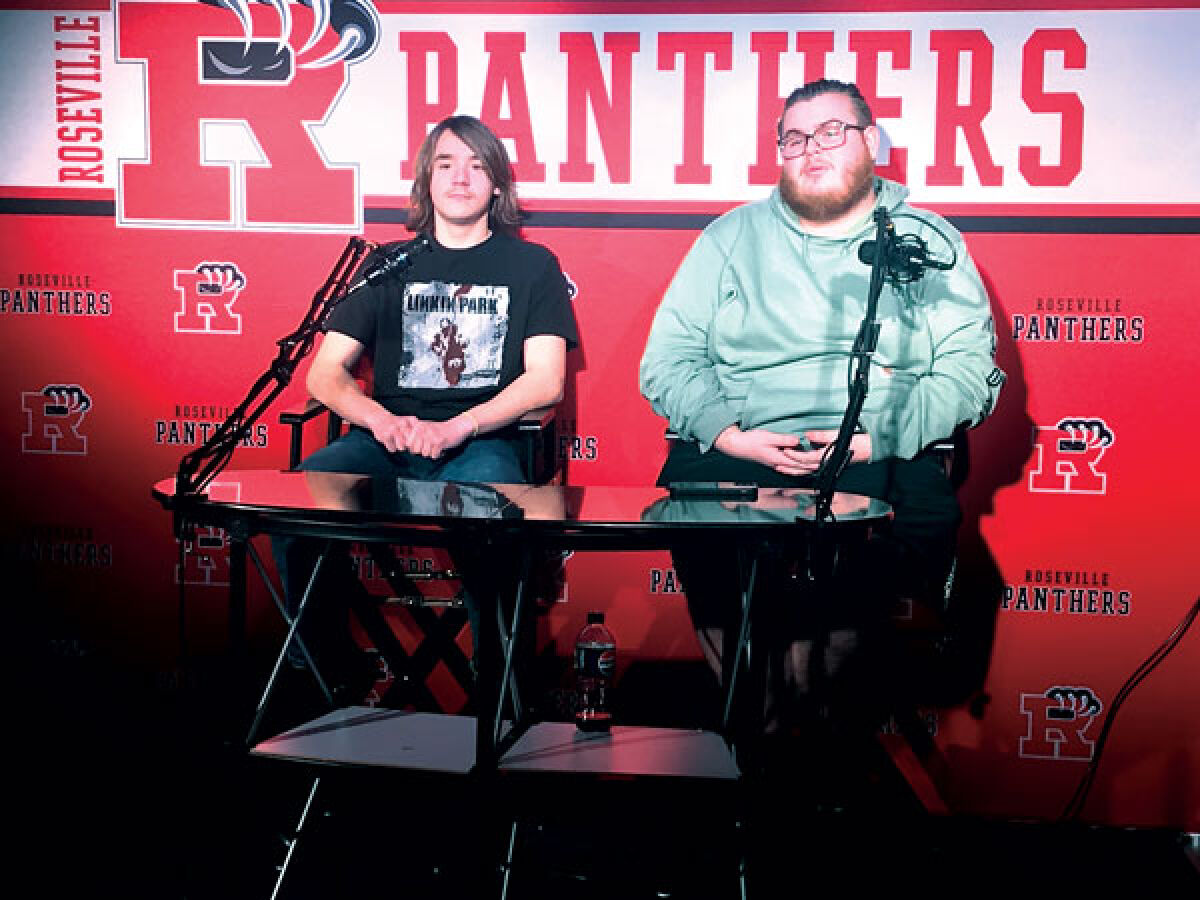  On Dec. 8, Roseville High School senior Kenny Steinhebel, left, and senior Jack Garlinghouse record the school’s announcements during the news and broadcasting production class. 