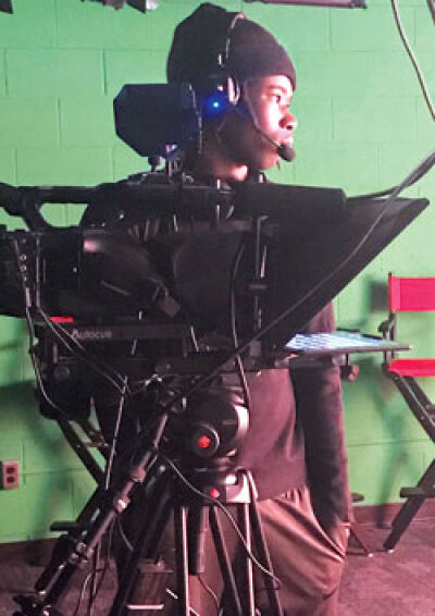  Roseville High School senior Dilynn Jackson operates the camera and teleprompter during class Dec. 8. 