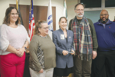  Martha Covert, second from left, and her husband Michael Covert, second from right, received the Outstanding Neighbor Award from Grafstein, middle. Council members Emily Rohrbach, far left, and Quinn Wright, far right, shared the moment. Other award winners included Joe and Rafid Jarbo of Amori’s Market with the Business of the Year Award, and Dianna Lutz as Volunteer of the Year.  