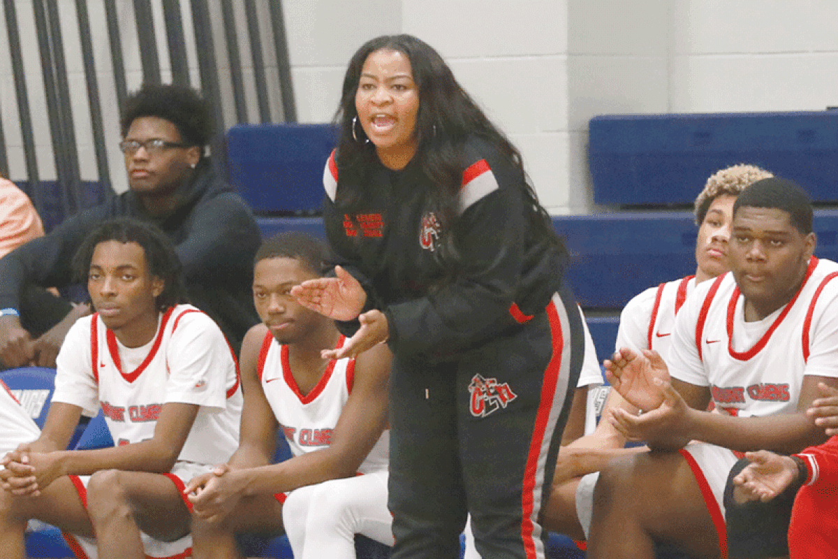  Mount Clemens High School varsity boys basketball coach Karlin Traylor cheers the team during a tournament in Detroit.  