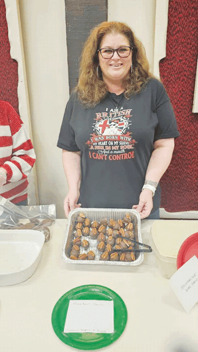  Fiona Norton, who was born in England, shows off her crowd-pleasing bourbon balls.  