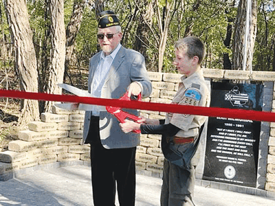 On Veterans Day, Utica Community Schools eighth grader Ben Wodniak unveils a war memorial that he created as his Eagle Scout project at American Legion Hill-Gazette Post 143 in Auburn Hills. The memorial features bricks carrying the names of soldiers who died in Desert Shield and Desert Storm in 1990 and 1991. 
