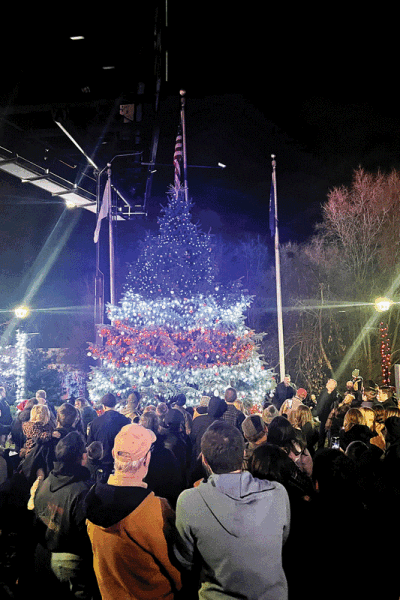  Attendees admire Utica’s Christmas tree as it lights up Memorial Park. 