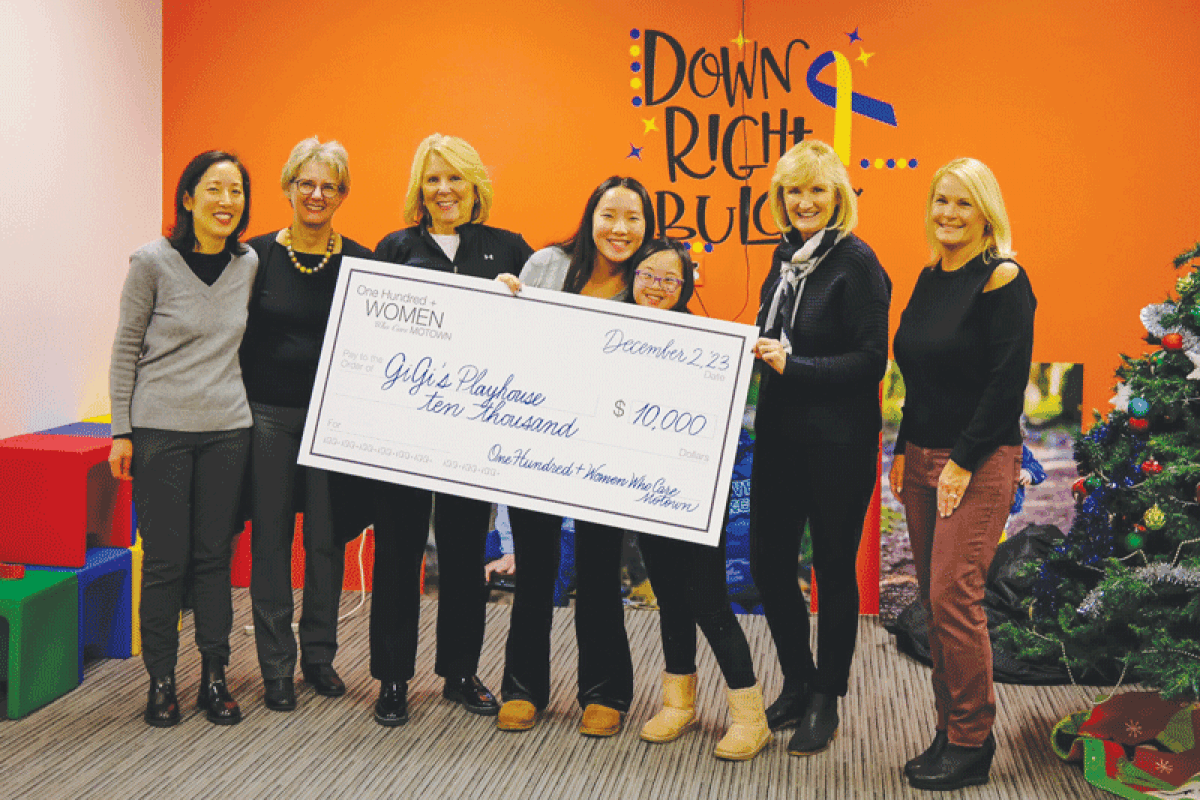  On Dec. 2, Elie Kim presented GiGi’s Playhouse Detroit with a check for $10,000 on behalf of 100+ Women Who Care Motown. Elie is pictured with her sister, Elena, and some of the women from 100+. 