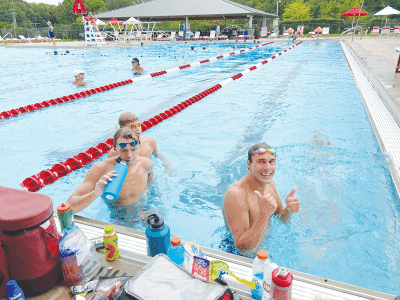  Aaron Helander works with swimmers at Heart of the Hills Swim Club in Rochester Hills. 