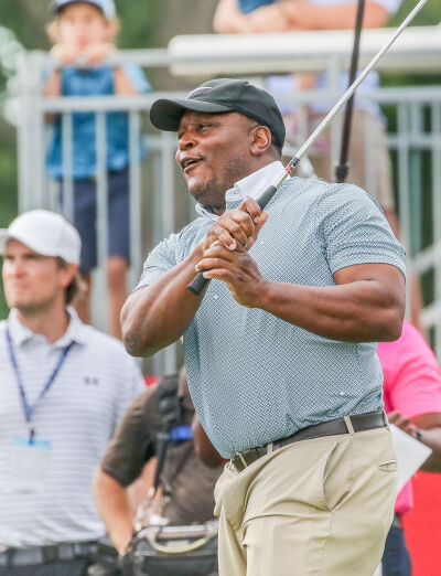  Hall of Famer Barry Sanders takes a swing on the 15th hole at the 313 Celebrity Scramble at Detroit Golf Club. 