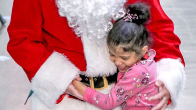  Retired educators help bring Christmas cheer to Academy of the Americas 