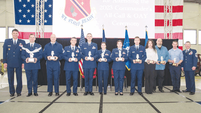  Brig. Gen. Matthew Brancato, left, commander of the 127th Wing, presents the 2023 recipients of the outstanding airmen, civilian employee and Commander’s Trophy awards on Dec. 2.  