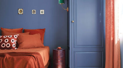  This bedroom features walls painted in Blue Nova, which is Benjamin Moore’s 2024 color of the year. 