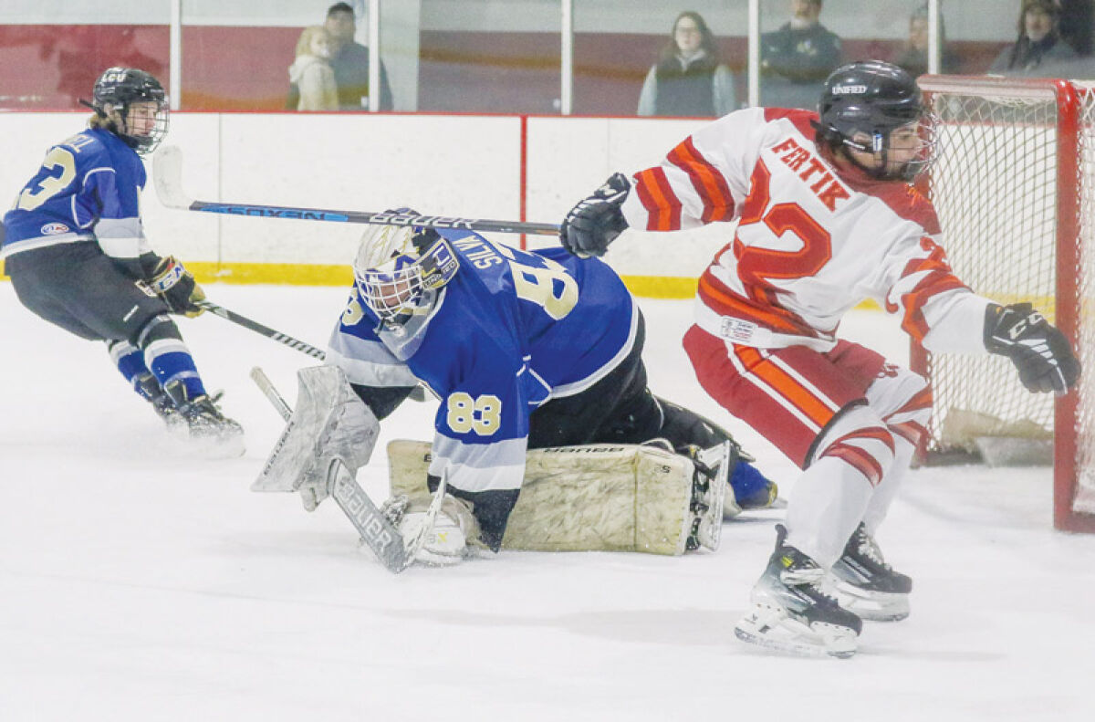  L’Anse Creuse Unified sophomore goalie Perez Silva makes a stop during a matchup against Utica Ford Unified on Jan. 5 at Big Boy Arena in Fraser. 