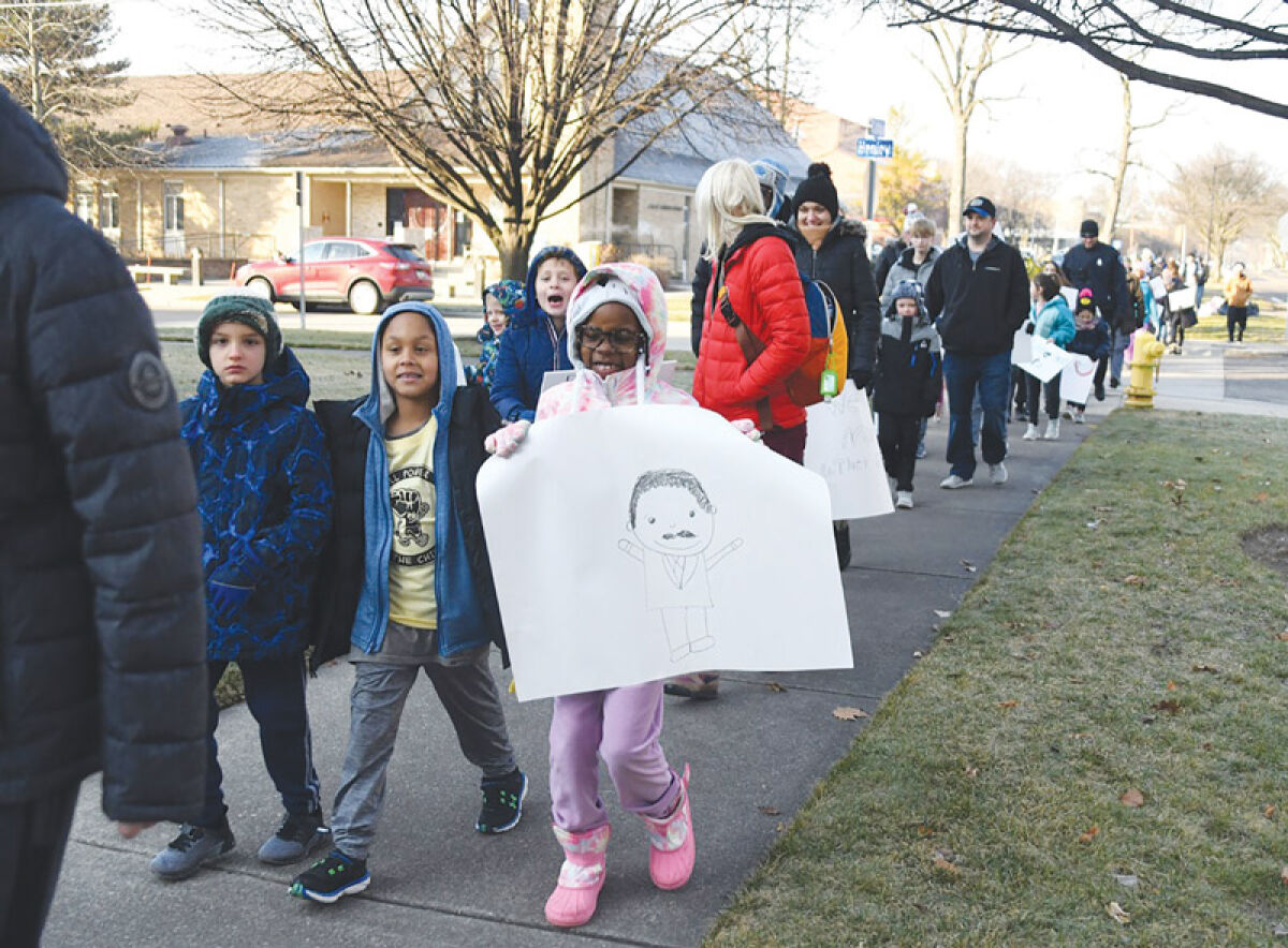  Attendees of the Berkley and Royal Oak schools’ 2023 Martin Luther King Jr. Day event, “A Day On, Not a Day Off,” participate in a Freedom Walk in Berkley. Clawson Public Schools has joined the celebration this year, which will take place Jan. 15. 
