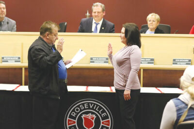  At the April 17, 2023, Roseville Community Schools Board of Education meeting, the school board voted 6-0 to appoint Denise Brun, right, to fill a vacancy on the school board. During the meeting, board Secretary Joseph DeFelice, left, administered the oath of office. Brun was appointed to fill a vacancy after board member Michael Anderson moved out of state and resigned his position. 